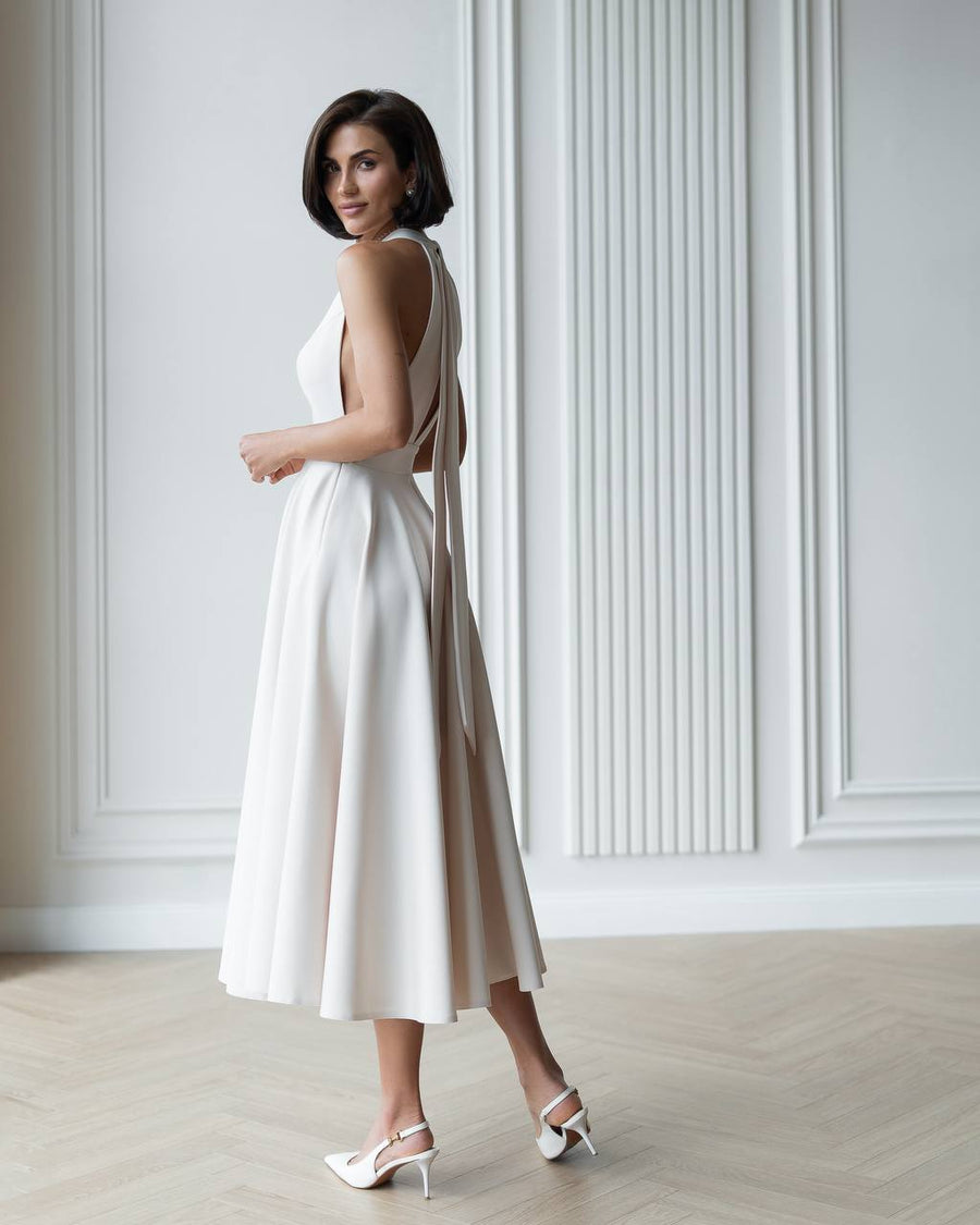Halter Neck Dress with Open Back and Flowy Skirt