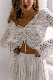 Knitted top with long sleeves