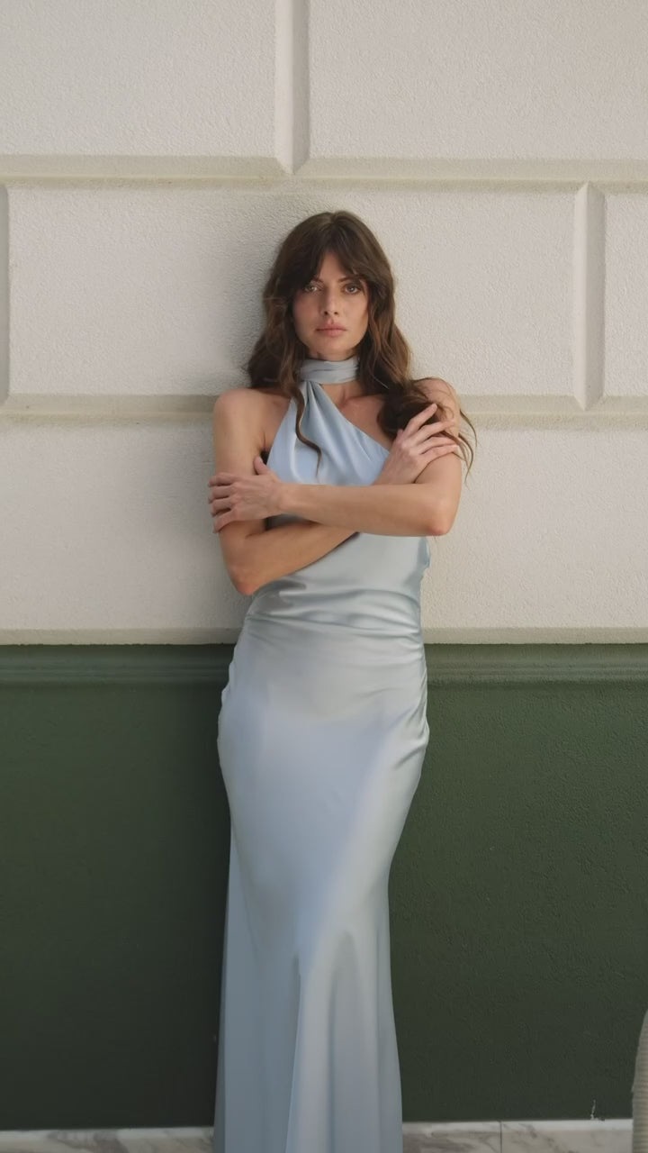 Beautiful woman in Paris Blue Satin Halter Maxi Dress